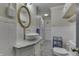 Bright bathroom featuring tile flooring, updated vanity, and a decorative mirror at 3357 Saddle Club Rd, Greenwood, IN 46143