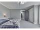Bedroom with gray walls, neutral carpet, ample closet space, and modern decor at 3357 Saddle Club Rd, Greenwood, IN 46143
