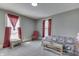 Cozy bedroom with gray walls, neutral carpet, and an abundance of natural light at 3357 Saddle Club Rd, Greenwood, IN 46143