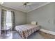 Bedroom with hardwood floors, natural light, ceiling fan, and light-colored walls at 3357 Saddle Club Rd, Greenwood, IN 46143