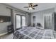 Bedroom featuring ceiling fan, TV, access to back patio at 3357 Saddle Club Rd, Greenwood, IN 46143