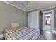 Bedroom with hardwood floors, neutral paint, ceiling fan, and a spacious closet at 3357 Saddle Club Rd, Greenwood, IN 46143