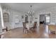 Bright dining room featuring hardwood floors and detailed blue and white wallpaper at 3357 Saddle Club Rd, Greenwood, IN 46143