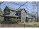 Charming two-story home with a covered porch and black aluminum fence at 3357 Saddle Club Rd, Greenwood, IN 46143