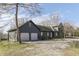 Exterior view of the home with an attached garage, set on a spacious lot at 3357 Saddle Club Rd, Greenwood, IN 46143