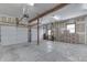 Spacious garage with ample room for parking, storage, and unfinished drywall at 3357 Saddle Club Rd, Greenwood, IN 46143