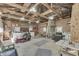 Large garage with space for multiple vehicles and tools, plus natural light from the windows at 3357 Saddle Club Rd, Greenwood, IN 46143