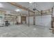 Open garage offering abundant storage options and potential for various projects at 3357 Saddle Club Rd, Greenwood, IN 46143