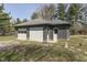 Detached garage provides parking and storage for vehicles and equipment, surrounded by yard at 3357 Saddle Club Rd, Greenwood, IN 46143