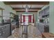 Open kitchen featuring stainless appliances, gray cabinets and eat-in area at 3357 Saddle Club Rd, Greenwood, IN 46143