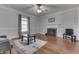 Large living room features a fireplace, ceiling fan and hardwood floors at 3357 Saddle Club Rd, Greenwood, IN 46143