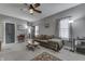 Comfortable living room with ceiling fan, neutral walls, gray carpet, and a cozy brown couch at 3357 Saddle Club Rd, Greenwood, IN 46143