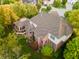 Aerial view of the home with screened in porch and lush greenery and surrounding trees at 3727 Tributary Ct, Westfield, IN 46062