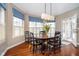Bright breakfast nook with a round wooden table, seating for six, and large sunlit windows at 3727 Tributary Ct, Westfield, IN 46062