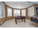 Finished basement game room has natural light, foosball table and pinball machine at 3727 Tributary Ct, Westfield, IN 46062