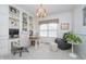Well-lit home office with built-in bookshelves, dual desks, and comfortable seating at 3727 Tributary Ct, Westfield, IN 46062