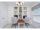 Home office features custom shelving, two desks, and great natural light at 3727 Tributary Ct, Westfield, IN 46062