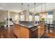 Open-concept kitchen featuring a large island with granite countertops and a breakfast bar at 3727 Tributary Ct, Westfield, IN 46062