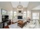 Bright and airy living room with high ceilings, a fireplace, and elegant furnishings at 3727 Tributary Ct, Westfield, IN 46062