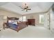 Spacious main bedroom with tray ceiling, ceiling fan, and plenty of natural light at 3727 Tributary Ct, Westfield, IN 46062