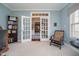 Stylish office offers French doors, built-in shelves, with neutral-toned walls and carpeted floors at 3727 Tributary Ct, Westfield, IN 46062