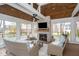 Bright sunroom with stone fireplace and lots of natural light creates a cozy and inviting atmosphere at 3727 Tributary Ct, Westfield, IN 46062