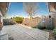 Concrete patio space with wood fence providing privacy in this home's backyard at 3875 Offshore Dr, Columbus, IN 47203