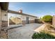 Backyard patio features concrete, with brick accents on the house, and a sliding glass door entrance at 3875 Offshore Dr, Columbus, IN 47203