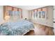 Bedroom with wood floors and bright double windows at 3875 Offshore Dr, Columbus, IN 47203
