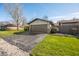 Home exterior featuring a two car garage, and green lawn area at 3875 Offshore Dr, Columbus, IN 47203