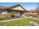 Well-maintained brick home with lush lawn and mature trees in a residential neighborhood at 3875 Offshore Dr, Columbus, IN 47203