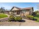 Charming brick home featuring manicured landscaping and inviting curb appeal at 3875 Offshore Dr, Columbus, IN 47203
