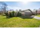Well-maintained home exterior with an attached two-car garage and a green lawn at 3875 Offshore Dr, Columbus, IN 47203