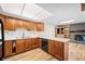 Open kitchen featuring wood cabinets, and views to the living space at 3875 Offshore Dr, Columbus, IN 47203