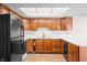 Functional kitchen featuring wood cabinets and a breakfast bar at 3875 Offshore Dr, Columbus, IN 47203