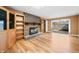 Bright living room features brick fireplace and sliding glass doors at 3875 Offshore Dr, Columbus, IN 47203