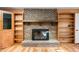 Cozy living room with wood floors and beautiful brick fireplace at 3875 Offshore Dr, Columbus, IN 47203