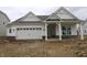 New construction home featuring white siding, brick accents, an attached garage, and covered front porch at 4016 Bozeman Way, Bargersville, IN 46106