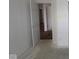 Hallway with white walls, unfinished floors, and open doorways at 4016 Bozeman Way, Bargersville, IN 46106