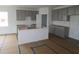New construction kitchen with gray cabinets, a center island, and bright natural light at 4016 Bozeman Way, Bargersville, IN 46106