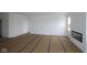 Open-concept living room with white walls, a modern fireplace, and large window for natural light at 4016 Bozeman Way, Bargersville, IN 46106