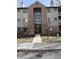 A three-story tan and brick building with dark window and door frames and minimal landscaping at 4291 Village Parkway W Cir # 3, Indianapolis, IN 46254