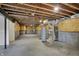 Unfinished basement with exposed beams and concrete flooring at 4372 Pine Bluff Dr, Bargersville, IN 46106