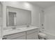 Bright bathroom features a double sink vanity with white cabinets and a large mirror at 4372 Pine Bluff Dr, Bargersville, IN 46106