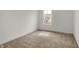 Carpeted bedroom offers neutral tones, a window with natural light at 4372 Pine Bluff Dr, Bargersville, IN 46106
