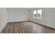 Well-lit bedroom with hardwood flooring, white walls, and large windows providing plenty of sunlight at 4372 Pine Bluff Dr, Bargersville, IN 46106