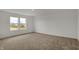 Bright bedroom featuring carpeted floors and natural light from the large double windows at 4372 Pine Bluff Dr, Bargersville, IN 46106