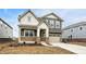 Charming two-story home with brick and gray siding, covered porch, and a well-manicured lawn at 4372 Pine Bluff Dr, Bargersville, IN 46106