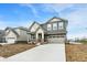 Beautiful two-story home with gray and white exterior, brick accents, and a two-car garage at 4372 Pine Bluff Dr, Bargersville, IN 46106