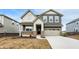 Attractive two-story house showcasing brick accents, gray siding, and a spacious two-car garage at 4372 Pine Bluff Dr, Bargersville, IN 46106